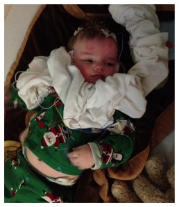 I look away for 2 minutes and he's draped himself in wires and other medical material.