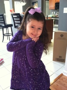 Arianna strikes a pose in a very fashionable ensemble.