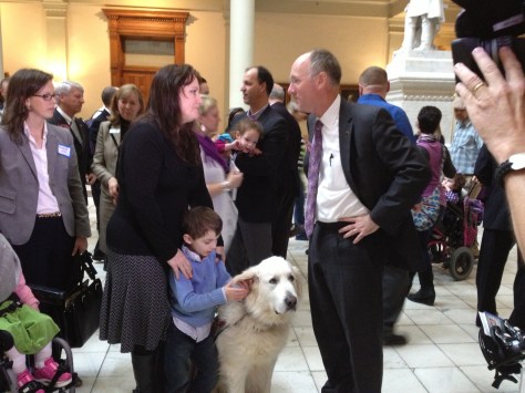 Wendi Scheck with son Hudson and Rep. Allen Peake (and service dog Denali).
