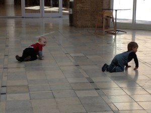 Malcolm doesn't mind crawling around with Connor, even though he can walk already.