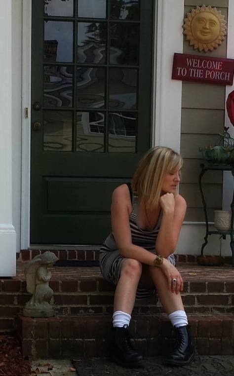 Kim sits on the front porch of her Georgia home, possibly for the last time, as they plan to put it on the market due to the expense of maintaining two households.
